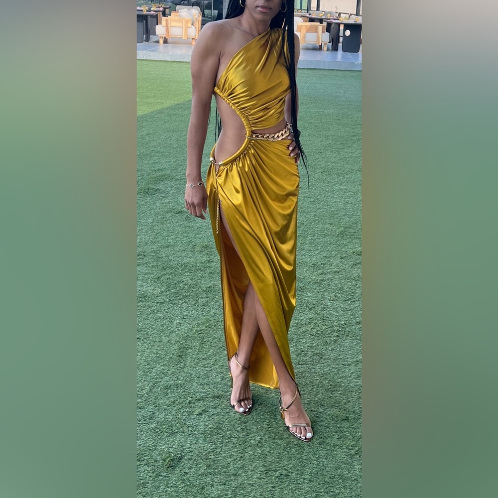 One shoulder beautiful gown in gold. Like new worn once.